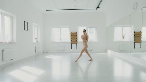 Ballerina Dancing In Studio