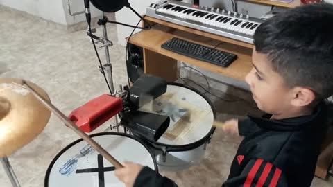 6 year old boy playing drums