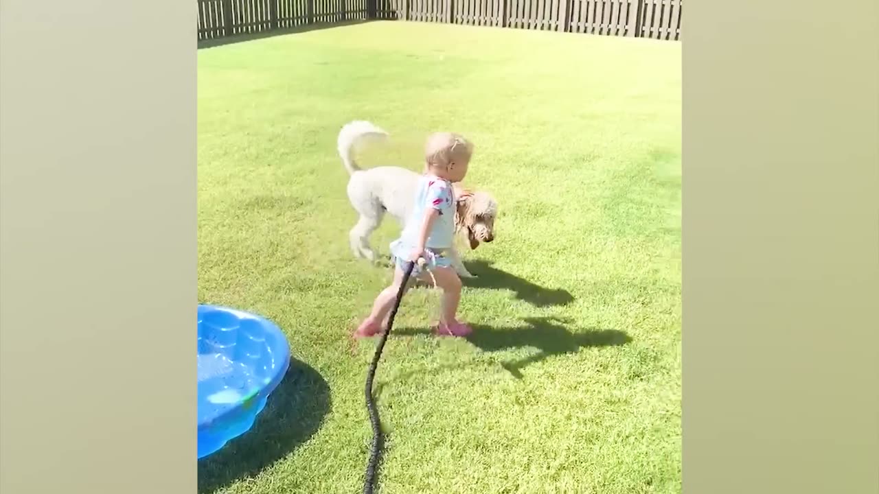 Funny baby playing with water