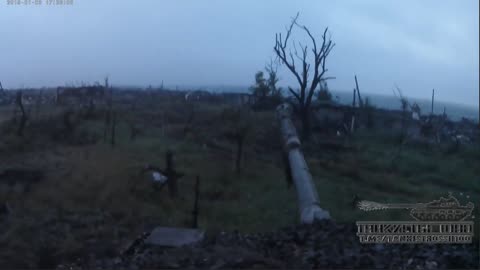 Tank crew direct fire at enemy positions in the village of Maryinka DNR