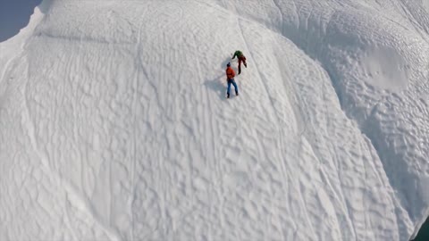 Two extreme athletes are trying to line their eyes