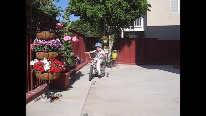 Scott rode the bike in the back yard