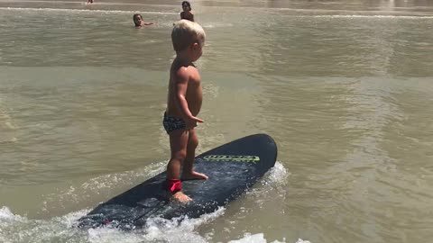 Cool Kid Surfs to Shore