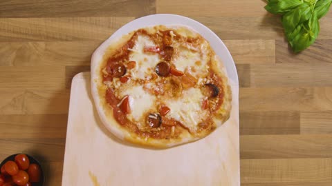 Top View Cooked Pizza on Peel Placed on Plate