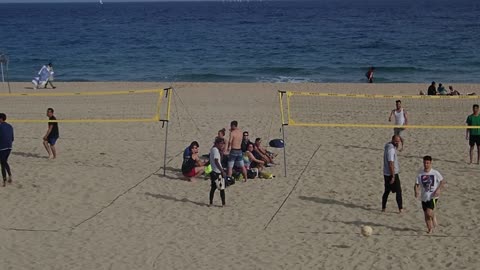 People Playing Volleyball At The Beach