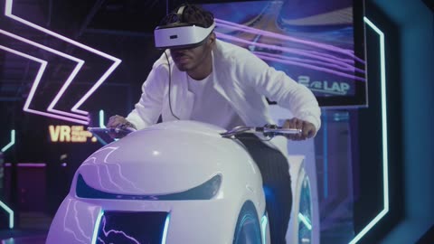 MAN PLAYING VR ARCADE GAME