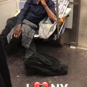 I heart ny man smokes on subway train
