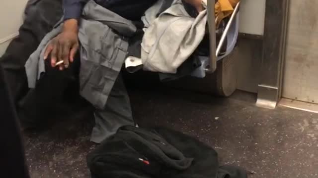 I heart ny man smokes on subway train