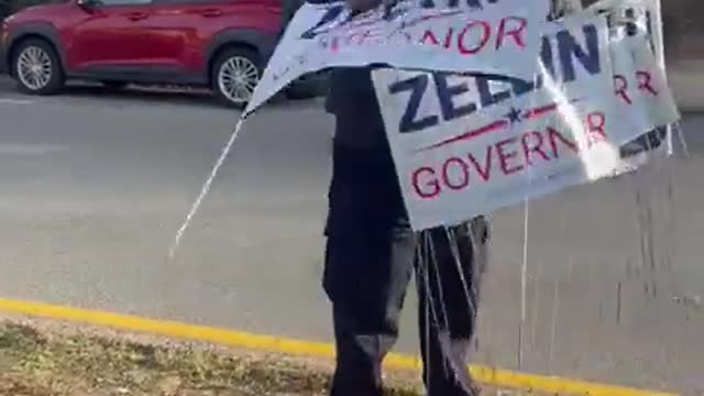 New York Woman in Police Uniform Takes Down "Lee Zeldin for Governor" Signs