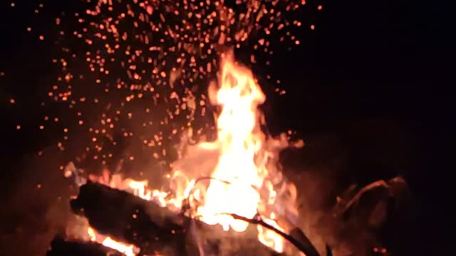 Blazing bonfire during night trekking in the wild