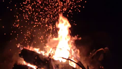 Blazing bonfire during night trekking in the wild