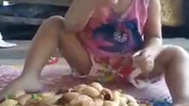 TODDLER EATING WORM