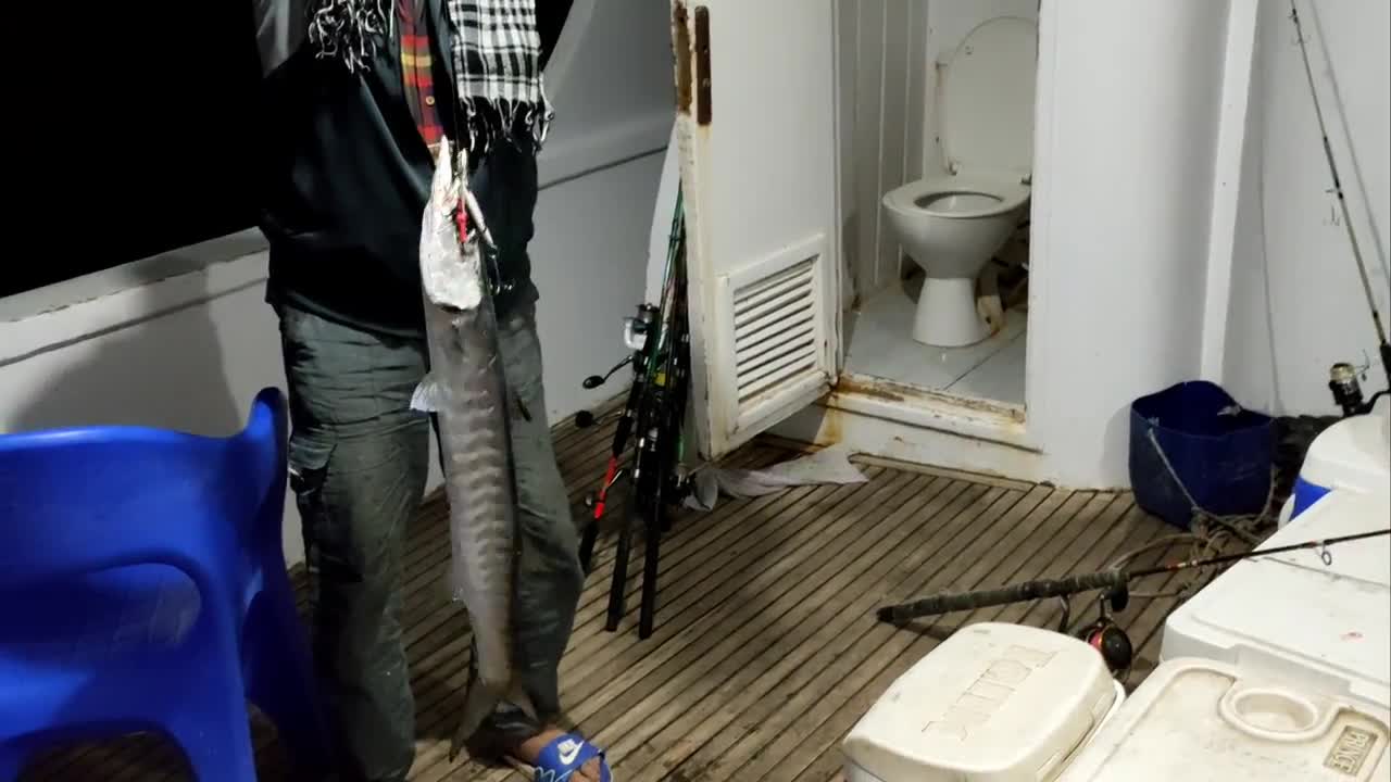 Teaching Aljikno Fishing Directly From The Sea On A Fishing Boat At Night