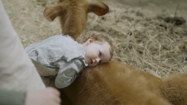 Playing with the pet goat - pure cuteness