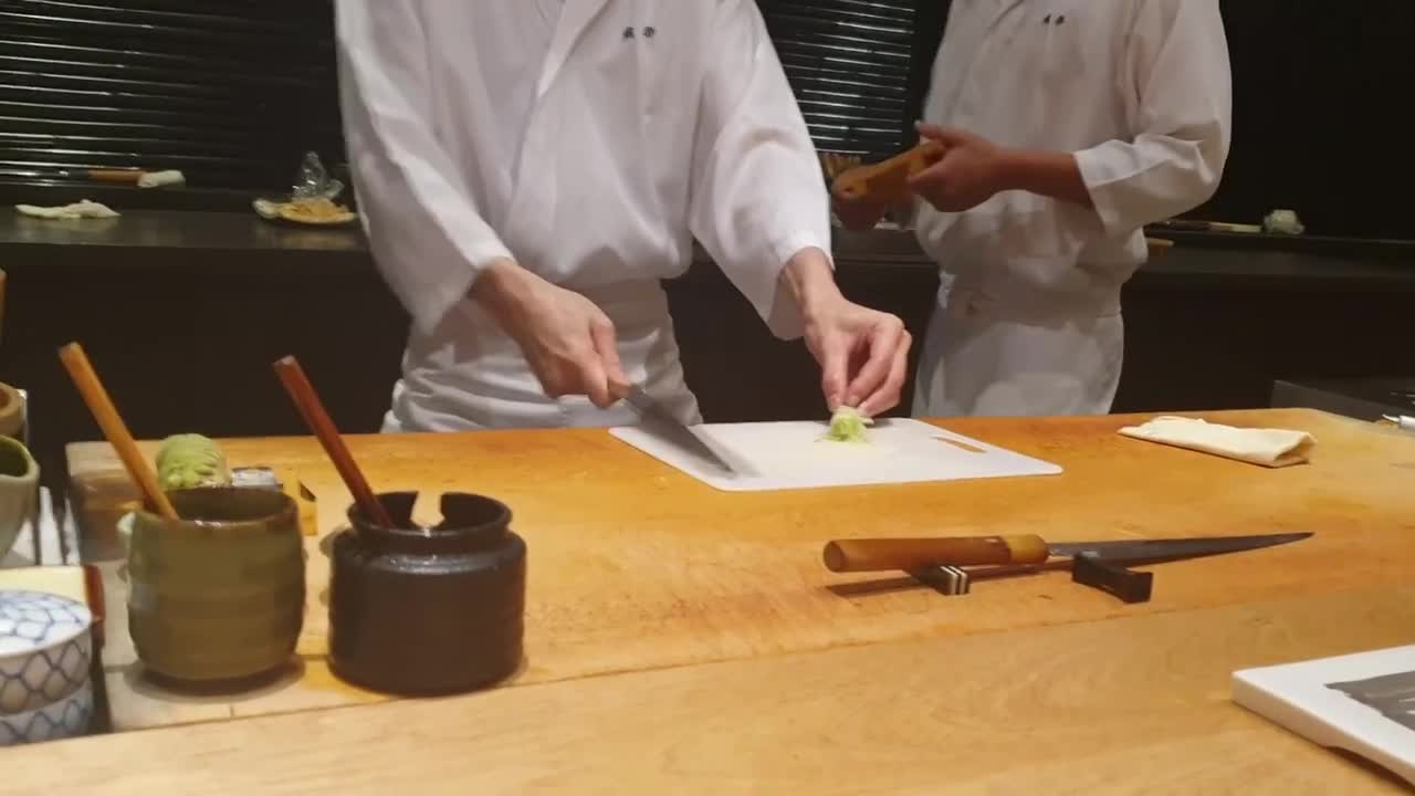 Japanese chef making flower using green onion