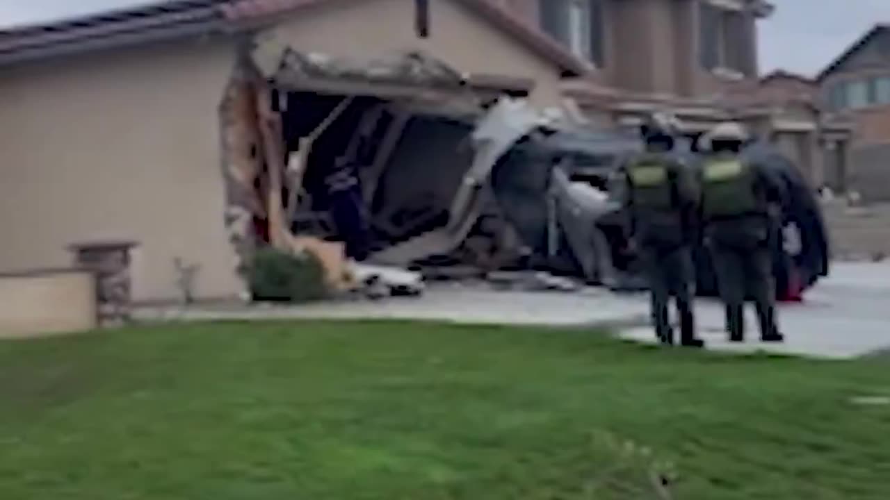 Moment when a car went airborne before crashing into a home garage in Jurupa Valley, California