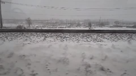 Snow scenery outside the Korean train