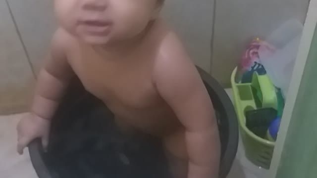 Cute Litte Asian Baby taking a bath