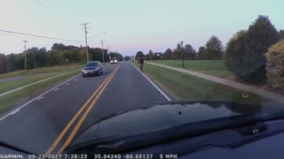 Cyclist Swerves All Over Road Before Toppling Over