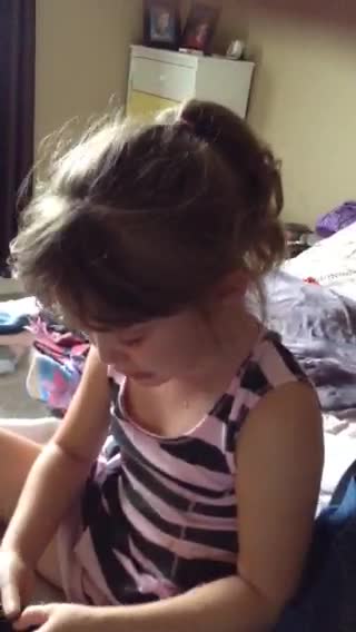 Little Girl Cries Because She Doesn't Want To Lose Her Loose Tooth