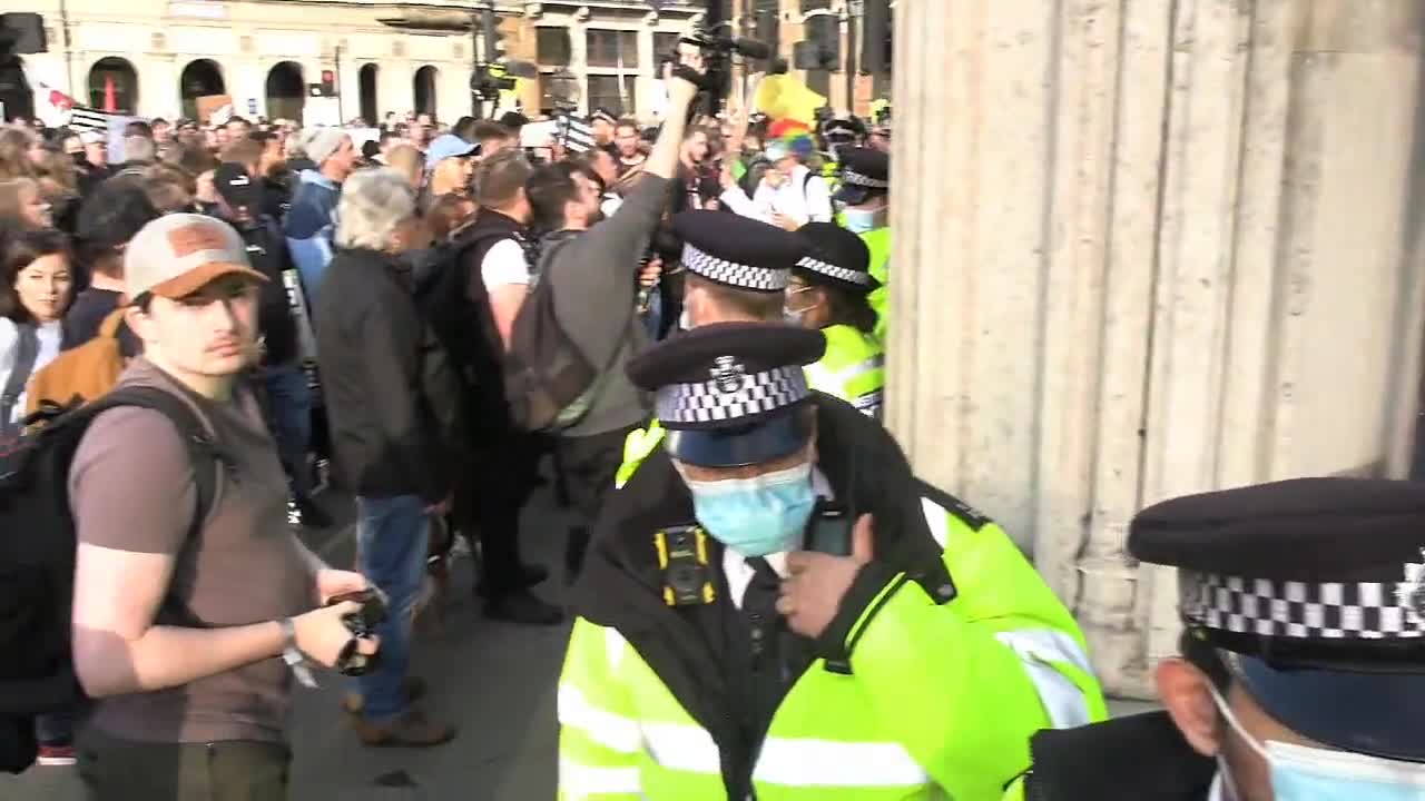 Shouts of "Nuremberg is coming" as anti Coronavirus passport protesters UK parliament.