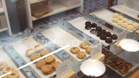 Cookies and sweets in a display cabinet at a shop