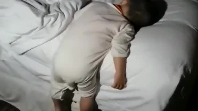 The strange sleeping position of the bear child