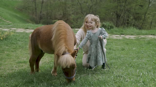 video young woman and little girl a miniature