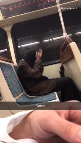 Guy covering head and face with black hat beanie slapping head