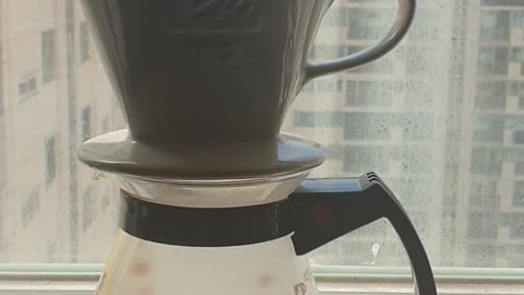 Hand drip coffee put the water