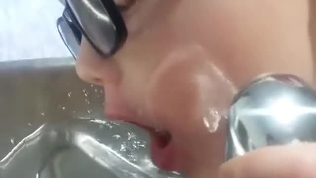 Drinking from the water fountain