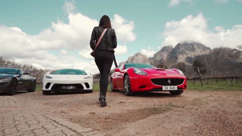 Beautiful girl and a group of supercars