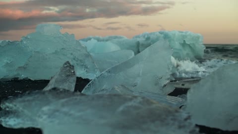 Icebergs breaking on the shore