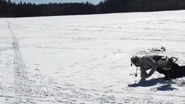 Man ice drill floor faceplant