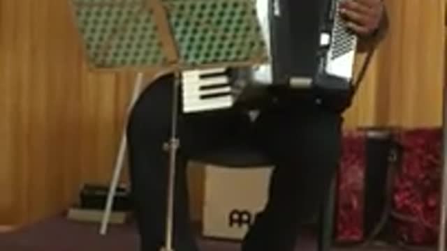 Marius playing accordion in Carand