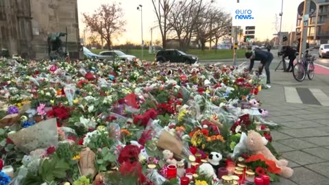 Candles and flowers flood makeshift memorial for Magdeburg market attack