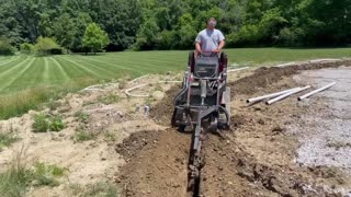 Trenching with Dingo for Drainline