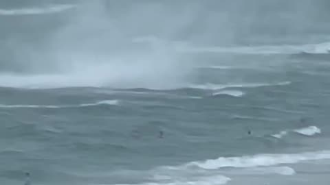 Footage captures waterspout ripping through crowded beach #Shorts