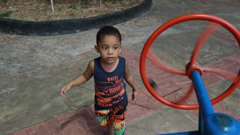 This child loves being in the park having fun