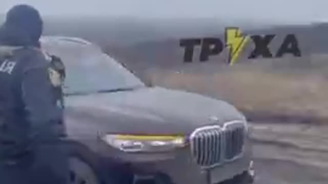 UKRAINIAN POLICE ESCORT A GROUP OF LUXURY CARS TOWARDS THE BORDER OF A EUROPEAN COUNTRY