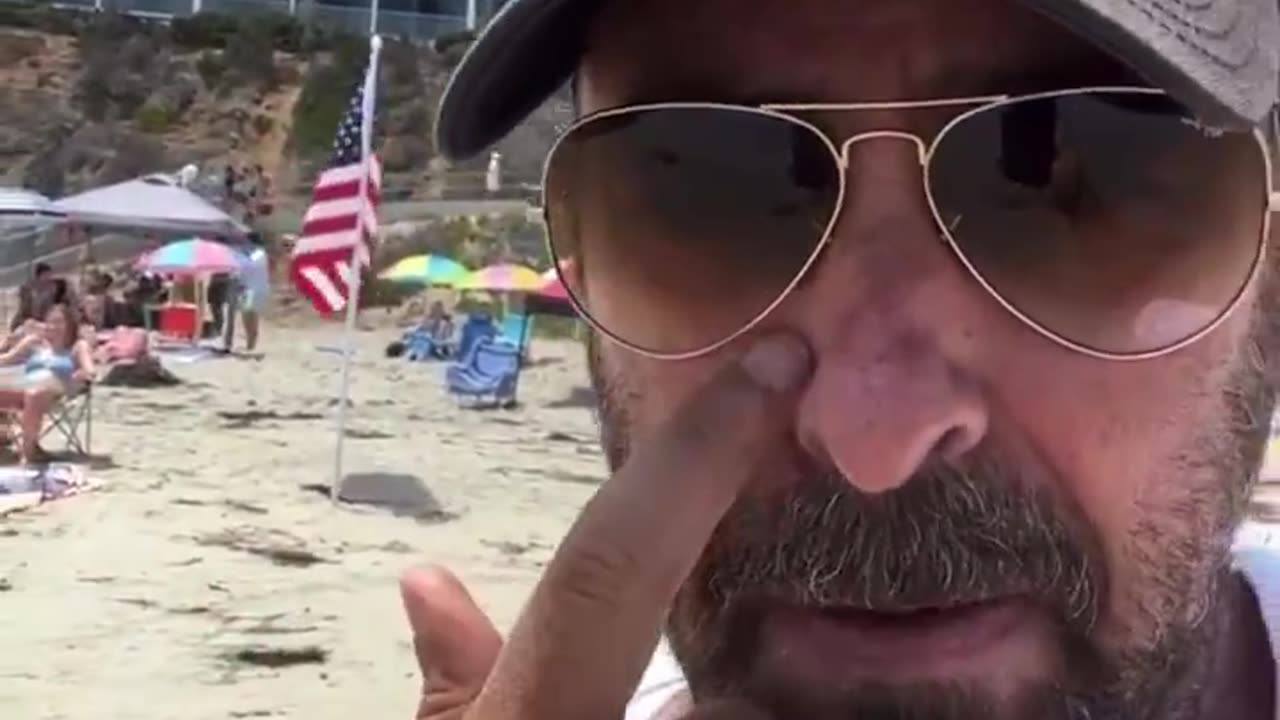 Liberal Man With Bad Attitude Has Problem With American Flags On Beach