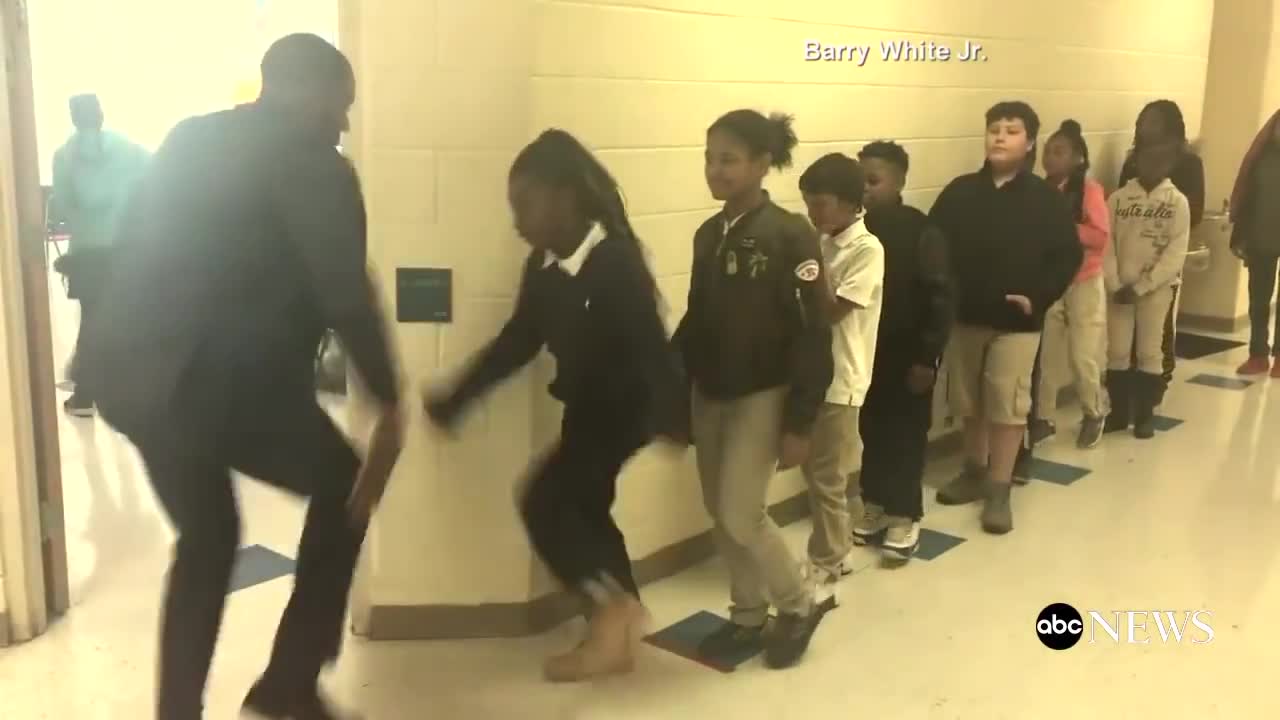 Teacher has incredible hand shake with each student