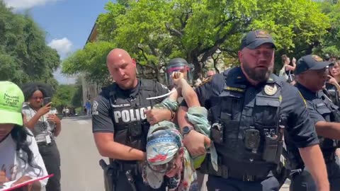 Police taking out the trash at UT Austin.