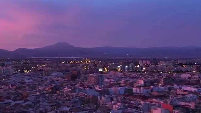 Evening city. Sunset of Spain.