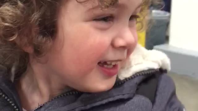 Happy Young Boy Saying Hello To Fellow Shoppers