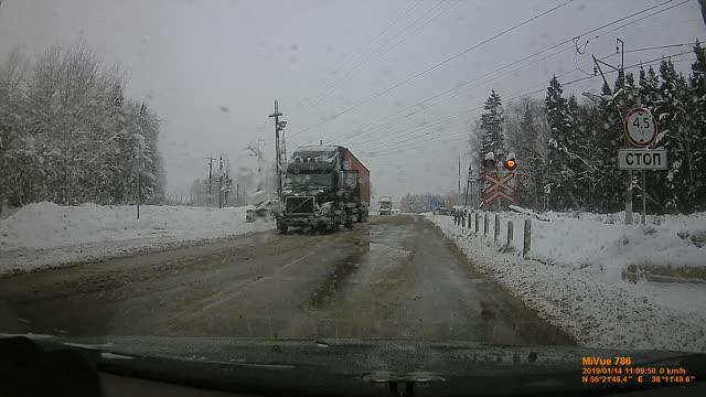 Stalled Semi Carrying Salt Ploughed by Train