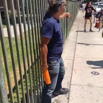 Korean man defends himself with water jug to the face after kicked in crotch by Antifa girl