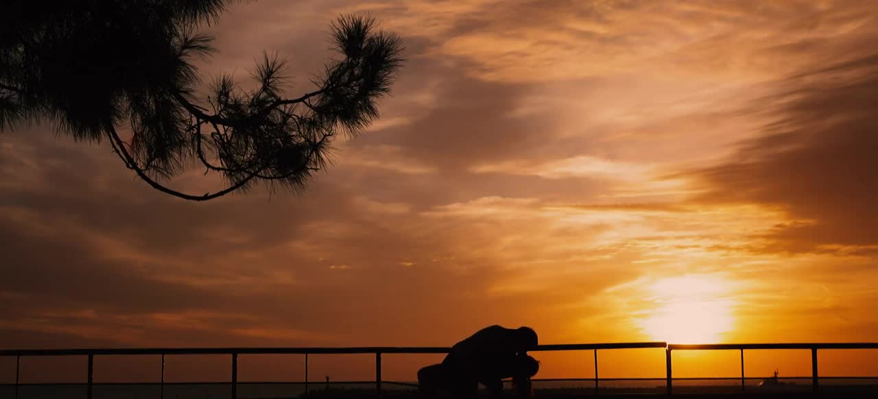 Lovers Holding Each Other On A Romantic Sunset