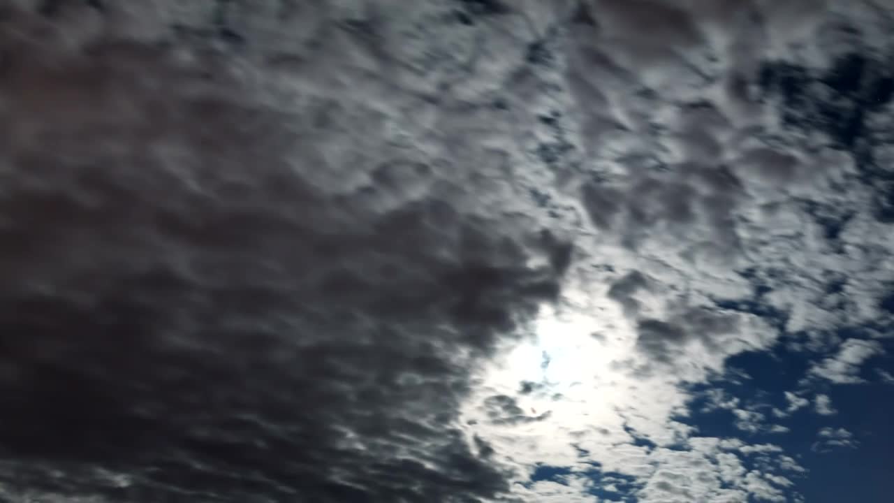 Cloudy sky clearing, low view