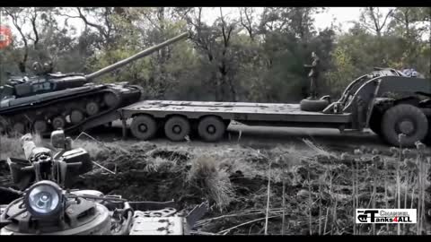 a BREM-1 armored recovery vehicle towing a IMR-2 military engineering vehicle, both captured